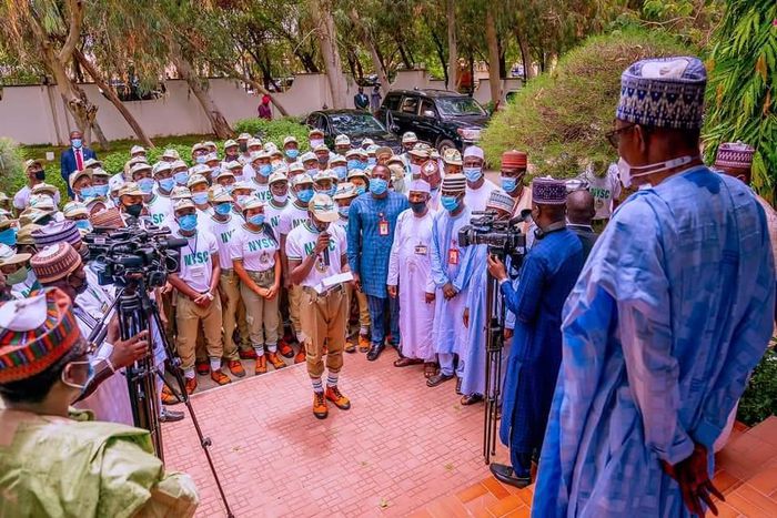 President Muhammadu Buhari with NYSC corps members [Presidency]