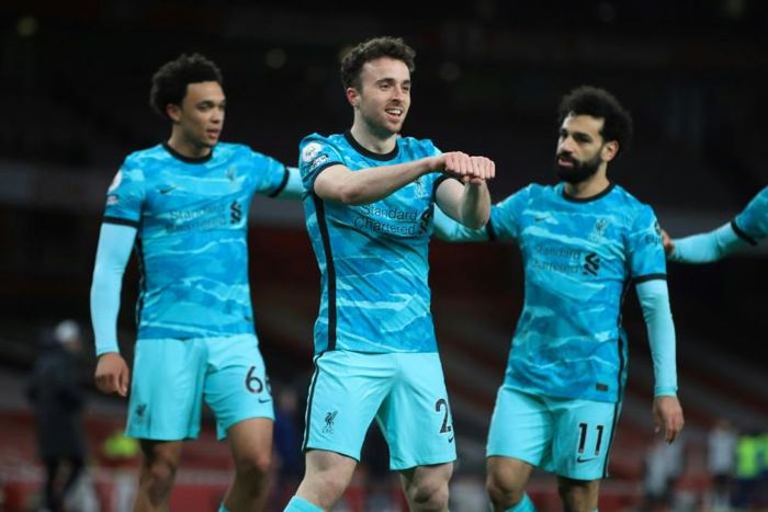 Super sub: Diogo Jota (centre) scored twice in a 3-0 win over Arsenal on Saturday