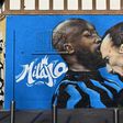 A street art mural near the San Siro stadium of AC Milan's Zlatan Ibrahimovic going head-to-head with Inter Milan's Romelu Lukaku.