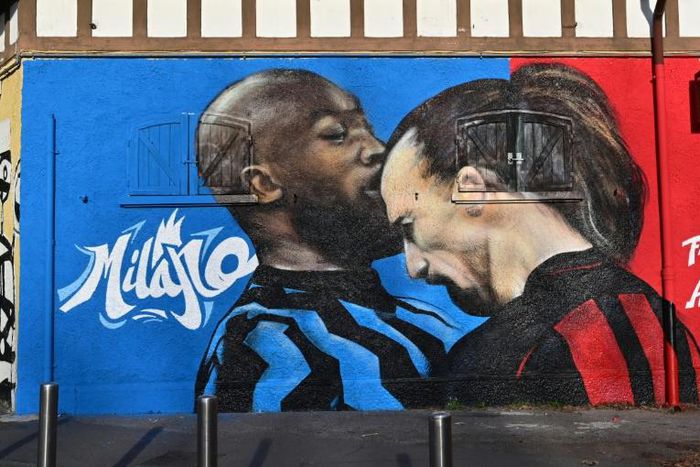 A street art mural near the San Siro stadium of AC Milan's Zlatan Ibrahimovic going head-to-head with Inter Milan's Romelu Lukaku.