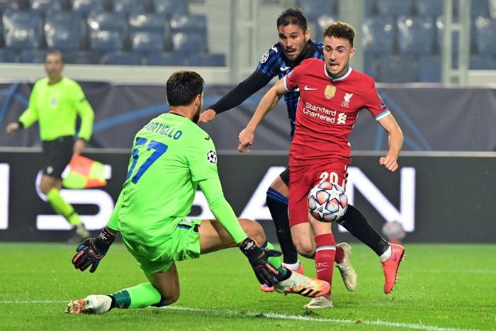 Liverpool's Diogo Jota (R) scored a hat-trick against Atalanta