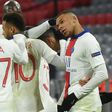 Kylian Mbappe (R) celebrates with his Paris Saint-Germain team-mates after scoring his second goal against Bayern Munich on Wednesday
