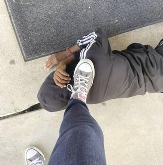 Teacher suspended over photo of her foot on pupil’s neck