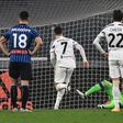 Atalanta goalkeeper Pierluigi Gollini (Rear Bottom) saves a Cristiano Ronaldo (2ndL) penalty in Turin.