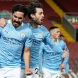 Ilkay Gundogan (left) scored twice at Anfield as Manchester City beat Liverpool 4-1