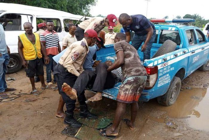 Ondo accident : Officials of the Road Safety Corps rescuing some of the  victims of the accident. (TVC)