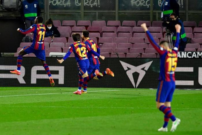 Ousmane Dembele (L) celebrates scoring the winner for Barcelona against Real Valladolid on Monday.
