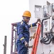 Electricity workers installing prepaid meters in homes. [NAN]