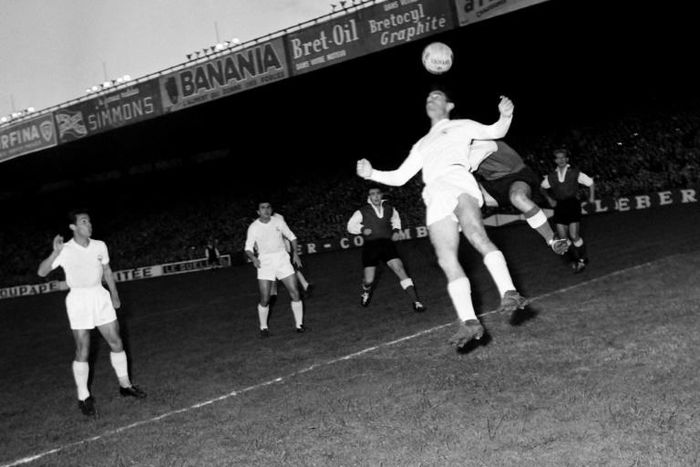 First to the ball: Raymond Kopa of Real Madrid holds off Michel Leblond of Reims in the first European Cup final in Paris in June 1956