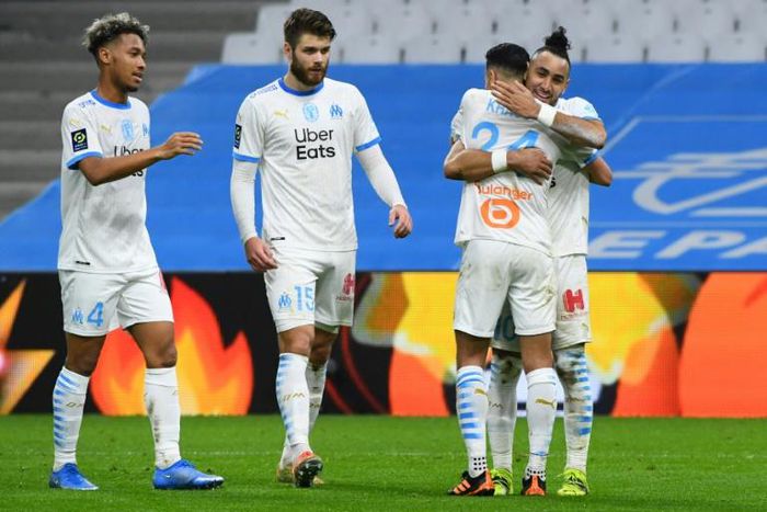 Marseille players celebrate after scoring in their 3-2 win over Nice in Ligue 1 on Wednesday