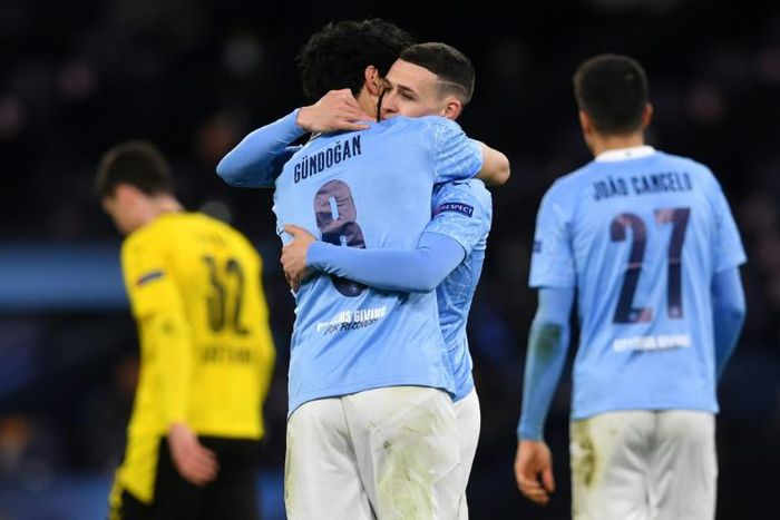 Manchester City midfielder Phil Foden (second right) celebrates his goal against Borussia Dortmund
