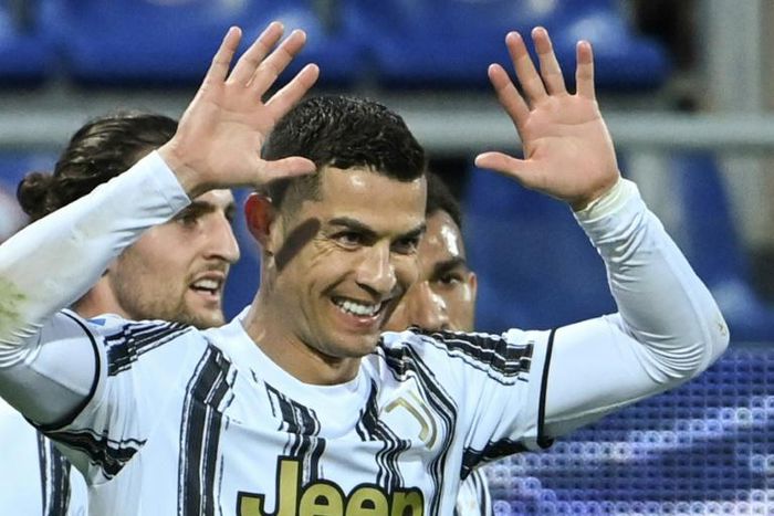 Cristiano Ronaldo celebrates after scoring his third goal against Cagliari.