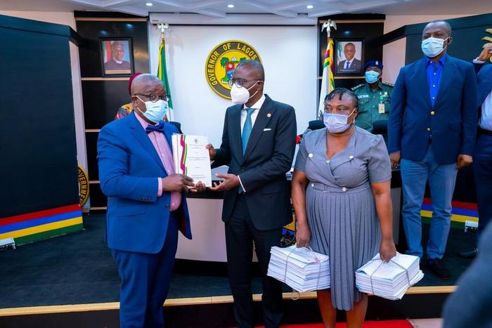 L-R: Chairman, Special Visitation Panel on the appointment of the 9th Vice Chancellor for Lagos State University (LASU), Prof. Bamitale Omole, presenting the report of the panel to the Lagos State Governor, Mr Babajide Sanwo-Olu. With them: Secretary o...