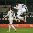 Marcus Thuram (C) celebrates scoring for Borussia Moenchengladbach in Friday's 4-2 win over Dortmund