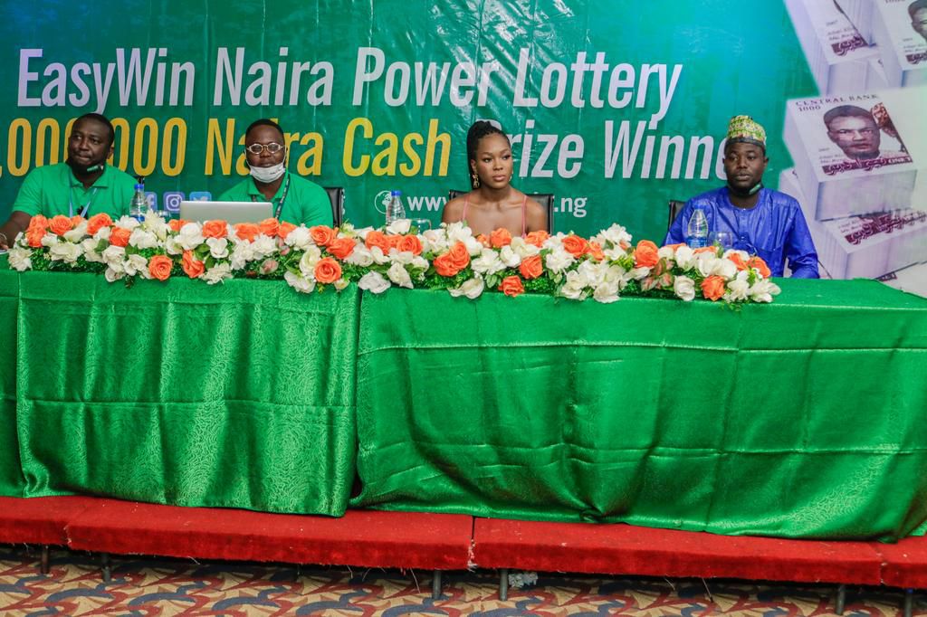 L-R: Isaac Nkemchor  - Business Development Manager Easywin Lotto ,  Adewale Aloyinlapa - City Manager, Easywin Lotto, Vee - Special Guest, Ibrahim Rabiu - Winner Easywin Jackpot