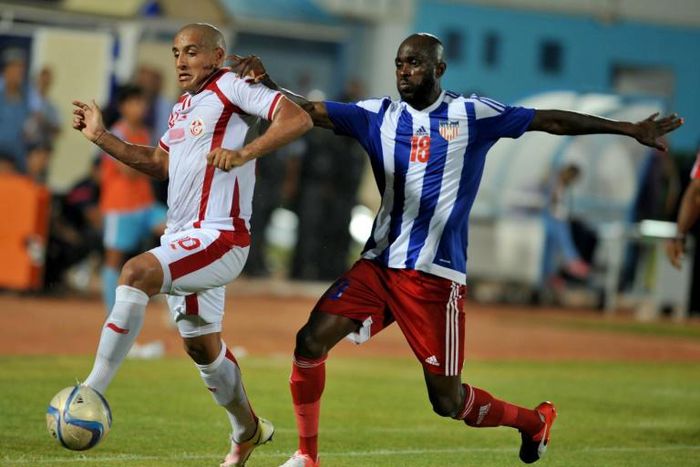 Anthony Laffor (R) playing for Liberia against Tunisia in an Africa Cup of Nations qualifier