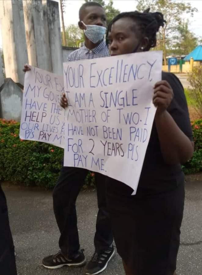 Nigerian magistrate & 2 sons protest over her 2 years' salary arrears
