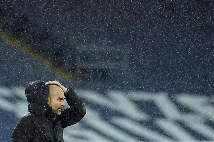 Pep Guardiola is soaked on the sidelines as Storm Bella battered the Etihad during Manchester City's win over Newcastle
