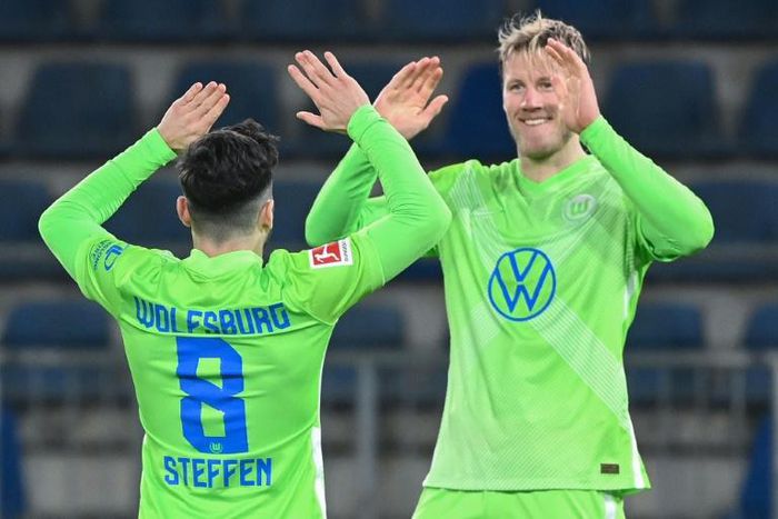 Two strikes: Wolfsburg midfielder Renato Steffen (left) celebrates scoring