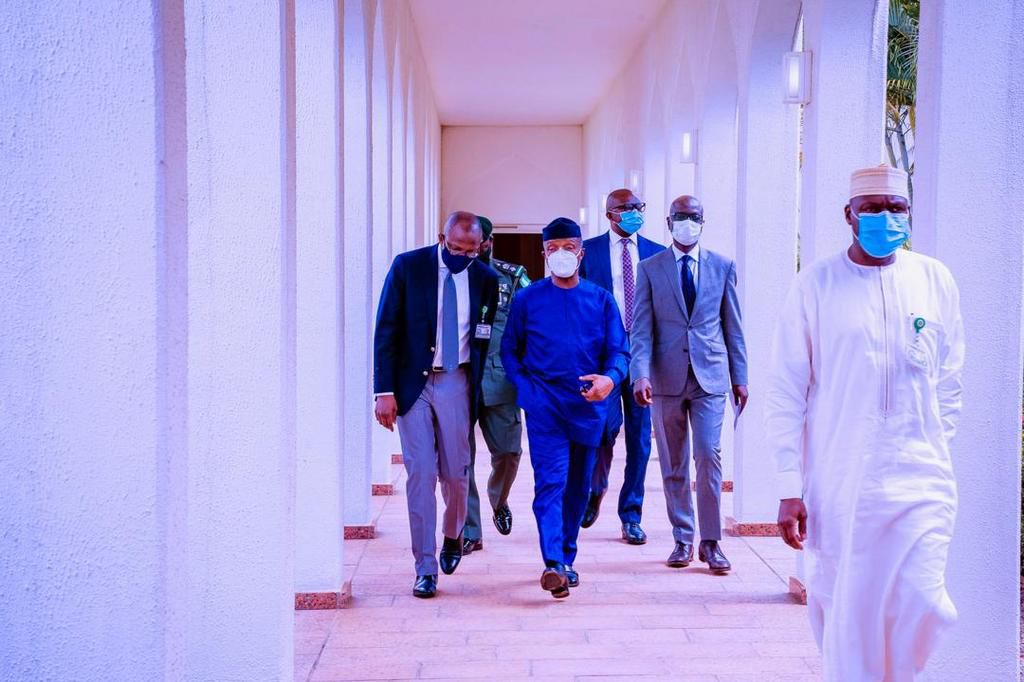 VP Osinbajo takes a walk down the power corridor with his aides
