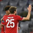Lewandowski (R) celebrates scoring his 71st Champions League goal in Bayern Munich's win over Salzburg