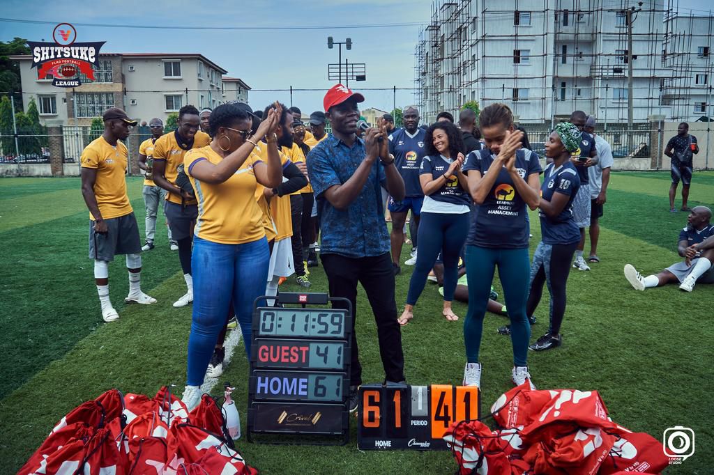 VBank rep, Muyiwa Olowoporoku, congratulates finalists.