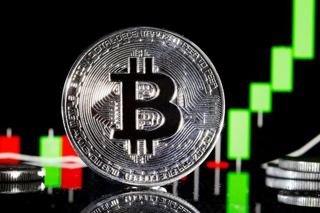 A visual representation of the digital Cryptocurrency, Bitcoin is on display in front of the Bitcoin course's graph