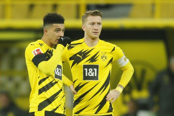 England winger Jadon Sancho (L) and Dortmund captain Marco Reus (R) have struggled to recapture their best form this season