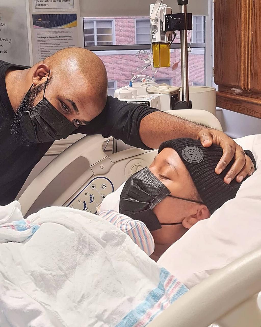 Pic 4 : Papa staring at Zaiah in amazement. A few minutes after he was born. I was EXHAUSTED. [Instagram/AdesuaEtomi]