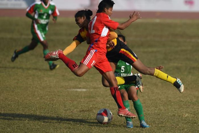 Nepal's all-time highest women's scorer Sabitra Bhandari (C, red jersey) welcomed the move