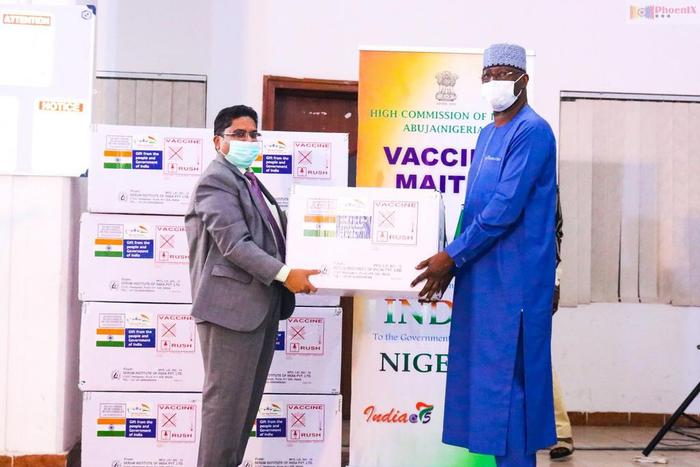 Chairman of the Presidential Task Force (PTF) on COVID-19 and Secretary to the Government of the Federation, Boss Mustapha receives the 100,000 doses of Covishield Vaccines from the Indian High Commissioner to Nigeria, Mr Velagaleti Surendra. [Twitter/...