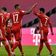 Serge Gnabry (R) celebrates his two goals for Bayern Munich