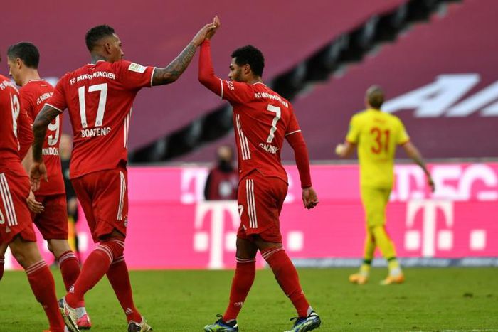 Serge Gnabry (R) celebrates his two goals for Bayern Munich