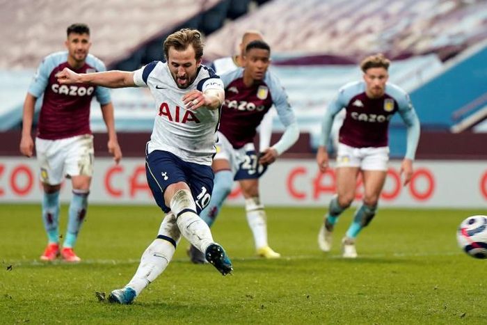 Spot on: Harry Kane (2nd left)sealed a much-needed win for Tottenham at Aston Villa