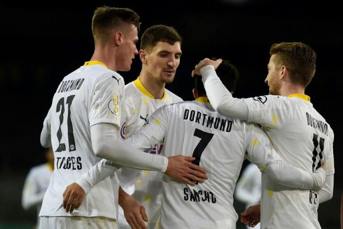 Jadon Sancho, No. 7, scored as Borussia Dortmund avoided a cup shock away to Eintracht Braunschweig