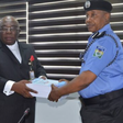 The chairman of the SIP, DIG Joseph Egbunike submitting panel report on Abba Kyari-Hushpuppi scandal to IGP, Usman Baba. (The Cable)