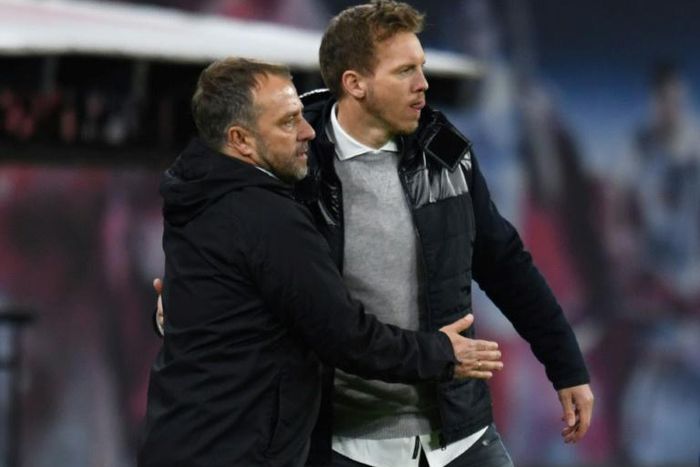 Leipzig head coach Julian Nagelsmann (R) hopes to put pressure on Bayern Munich and their boss Hansi Flick (L)