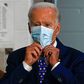 Former Vice President Joe Biden puts on a mask after a campaign event on July 28, 2020.