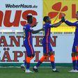 Christopher Nkunku (C) celebrates scoring for RB Leipzig at Freiburg on Saturday