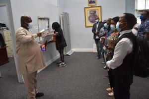 Amb. Lot Egopija attending to passport applicants at Nigeria House in New York. [NAN]