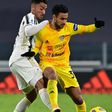 Algerian midfielder Adam Ounas (R) holds off Juventus defender Danilo when playing for Cagliari last November in Turin.