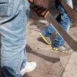 Machete wounds litter two corpses of two students suspected to be cult members.