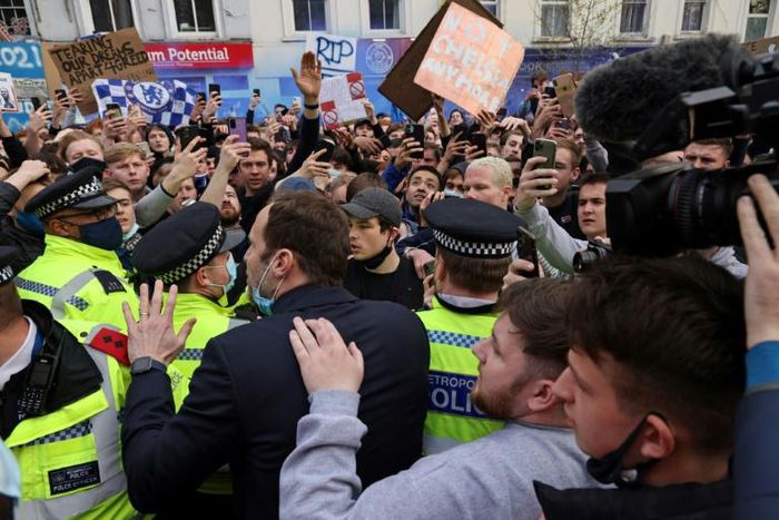 Chelsea's Petr Cech (3L) attempts to talk to supporters outside Stamford Bridge