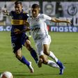 Carlos Tevez (L) and Boca Juniors were knocked out by Santos in the semi-finals