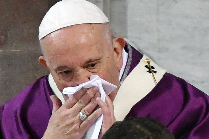 Pope Francis wipes his nose during the Ash Wednesday mass which opens Lent, the forty day period of abstinence and deprivation for Christians before Holy Week and Easter, on February 26, 2020, at the Santa Sabina church in Rome.