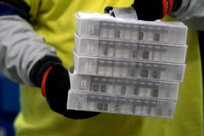 Boxes containing the Pfizer-BioNTech COVID-19 vaccine are prepared to be shipped at the Pfizer Global Supply Kalamazoo manufacturing plant in Portage, Michigan on Sunday, December 13, 2020.