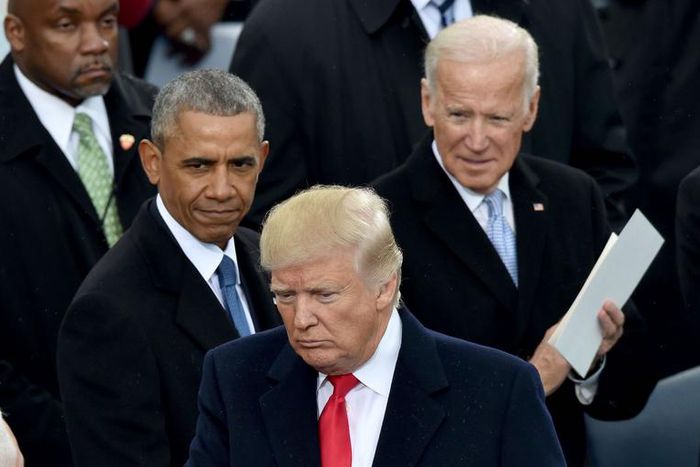 US President Donald Trump(2nd-R) shakes hand with Vice President Mike Pence(L) as former President Barack Obama and former Vice President Joe Biden(R) look on Trump's inauguration ceremonies at the US Capitol in Washington, DC, on January 20, 2017.