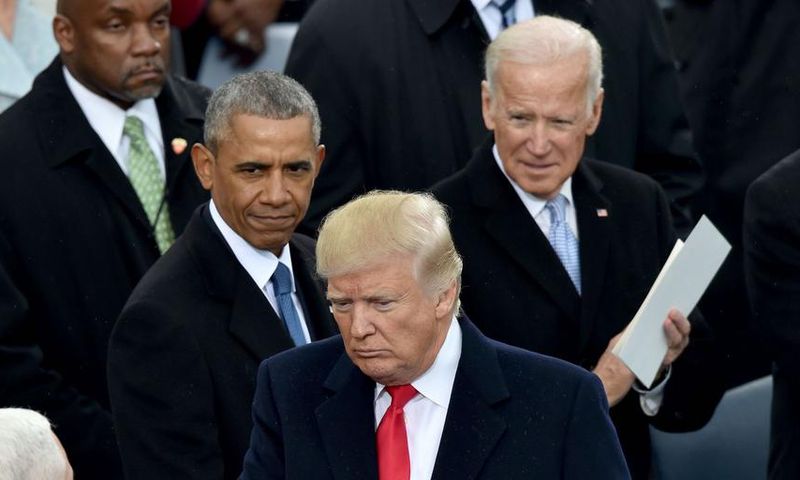 US President Donald Trump(2nd-R) shakes hand with Vice President Mike Pence(L) as former President Barack Obama and former Vice President Joe Biden(R) look on Trump's inauguration ceremonies at the US Capitol in Washington, DC, on January 20, 2017.