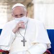 Pope Francis wearing a mask.