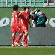 Bayern Munich Jamal Musiala (R) celebrates scoring against Wolfsburg on Saturday